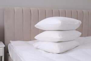 white-soft-pillows-bed-room_495423-39706